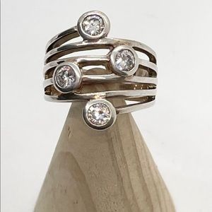 Vintage Precious Designs, silver ring with cz gems on a wide band size 6.75.